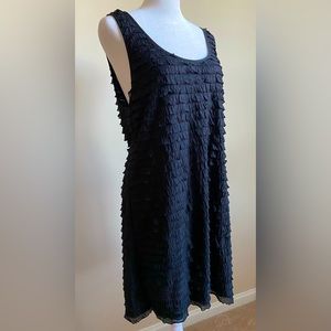 Free People little black mini dress with ruffles.